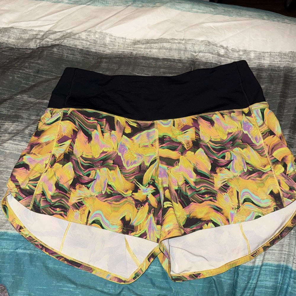 lululemon athletica. Speed up. High rise. 4in inseam. Mood enhancer yellow multi